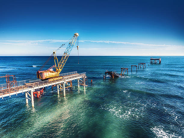 istock Aerial view of work crane on the broken bridge 637080106