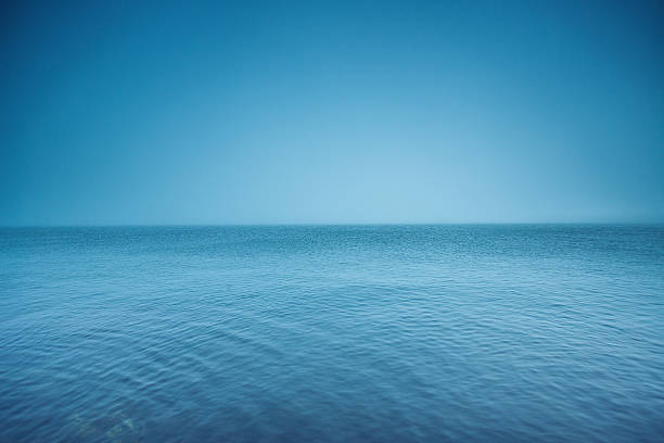 istock Cloudy horizon. Fog over the sea waves, natural background 637080178