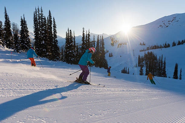 istock Friends skiing on a sunny day 637080200