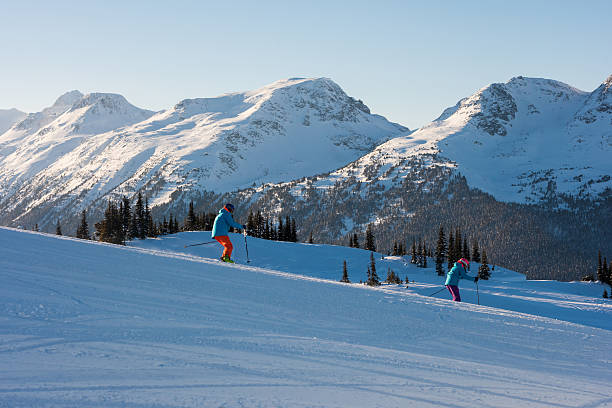 istock Couple skiing on a sunny day 637080470