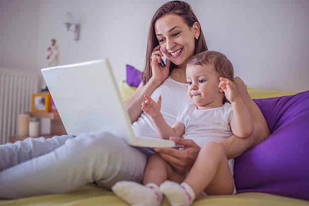 istock Mom and daughter on laptop 637081700
