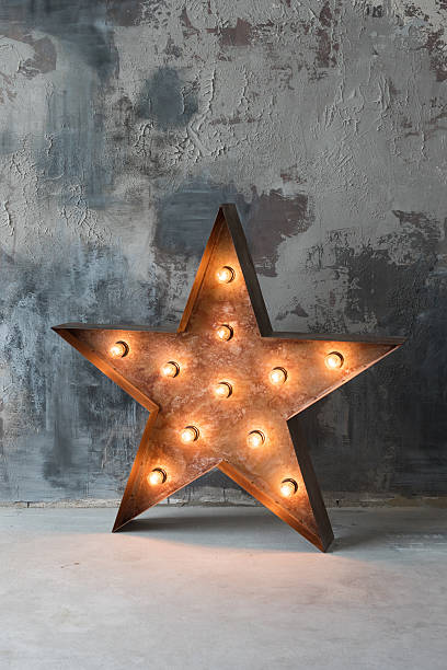 istock Large decorative retro star with lots of burning lights on 637083102