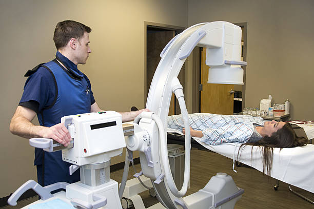 istock doctor preparing patient for X-ray 637083206
