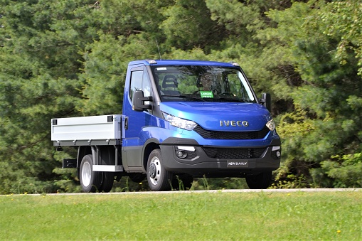 Balocco, Italy - June, 5th, 2014: Third generation of IVECO Daily driving on the road during the press launch. From debut of the first generation IVECO produced over 2 600 000 pieces of Daily.