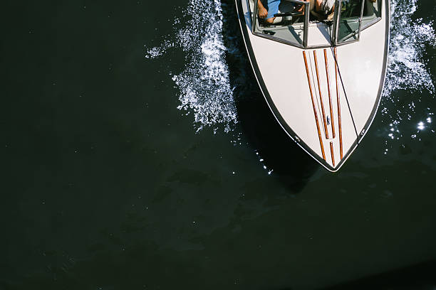 Aerial view of a boat speeding through a river of Argentina