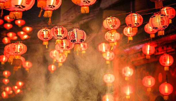 Chinese new year lanterns in chinatown Chinese new year lanterns in chinatown, firecracker celebration lanterns at night stock pictures, royalty-free photos & images