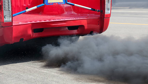 istock Air pollution from vehicle exhaust pipe on road 637086638