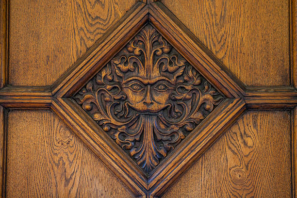 Oxford, UK - August 12th 2016: A beautiful carved door to Brasenose College in Oxford.  The design, a maned lion-like face is said to be an inspiration behind the famous CS Lewis book - The Lion The Witch and the Wardrobe.