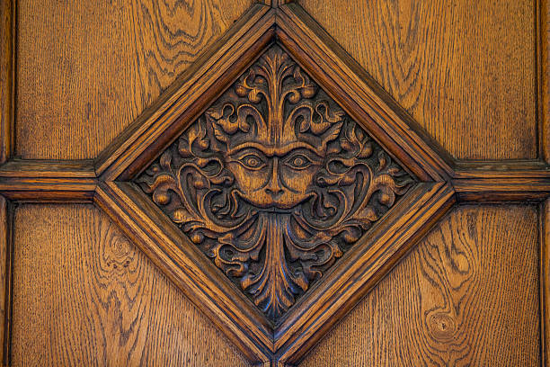Narnia Door in Oxford Oxford, UK - August 12th 2016: A beautiful carved door to Brasenose College in Oxford.  The design, a maned lion-like face is said to be an inspiration behind the famous CS Lewis book - The Lion The Witch and the Wardrobe. oxford university photos stock pictures, royalty-free photos & images