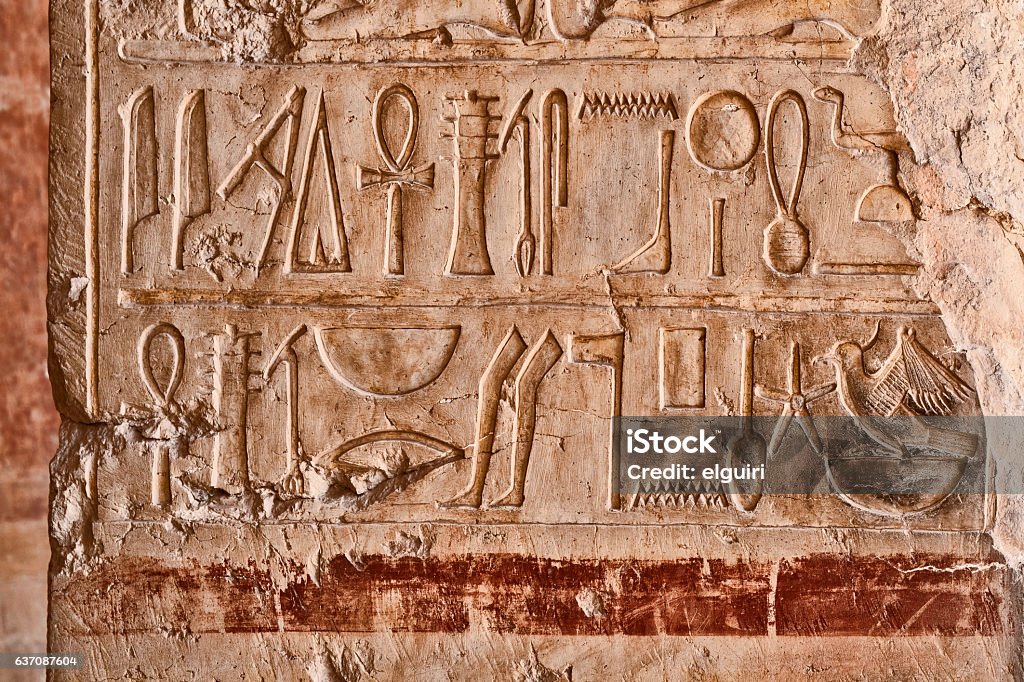 Hieroglyphic Panel Wonderfully preserved panel of Egyptian hieroglyphics including the "Feather of Ma'at" and the Ankh or symbol of life. This photograph was taken in Cairo in December 2016. Ankh Stock Photo