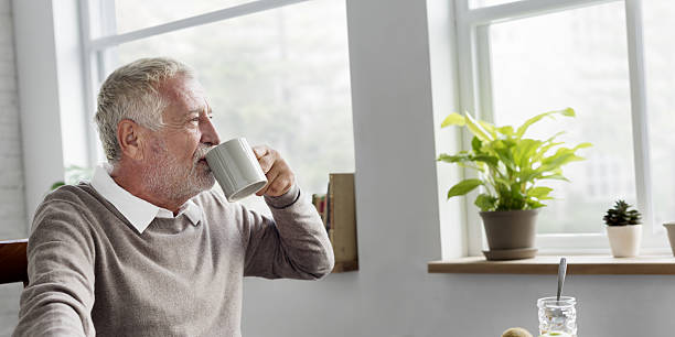 istock Senior Adult Drinking Water Mug Concept 637088402