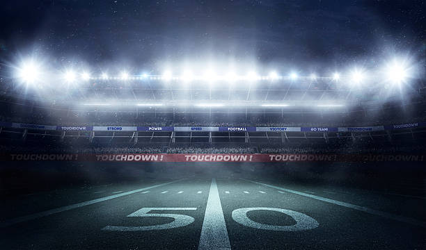 istock football stadium 3D in lights at night render 637088712