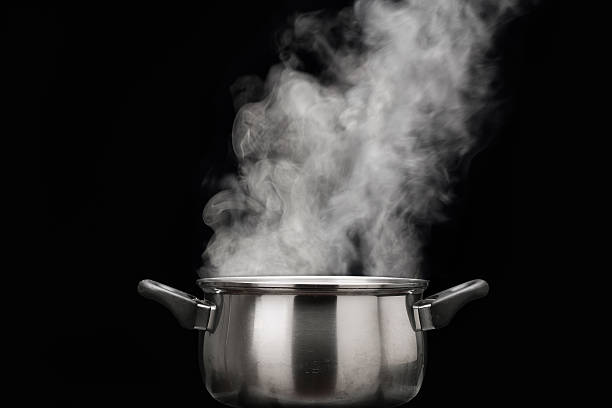 steam over cooking pot steam over cooking pot boiling stock pictures, royalty-free photos & images