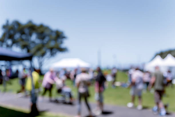 istock Blur defocused background of people in park 637092514