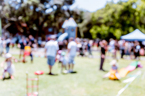istock Blur defocused background of people in park 637092534