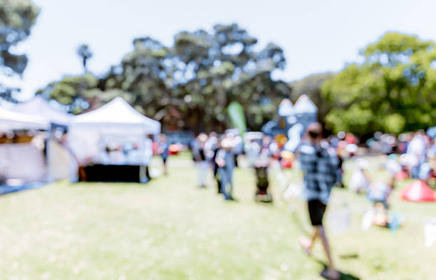 istock Blur defocused background of people in park 637092572
