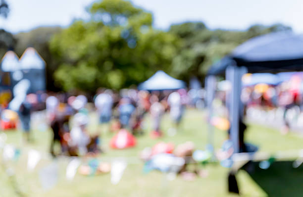 istock Blur defocused background of people in park 637092586