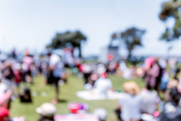 istock Blur defocused background of people in park 637092666