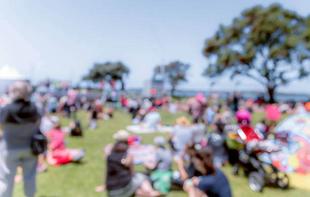 istock Blur defocused background of people in park 637092674