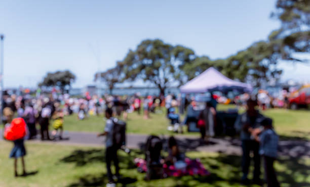 istock Blur defocused background of people in park 637092704
