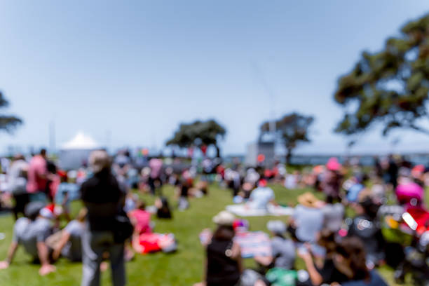 istock Blur defocused background of people in park 637092712