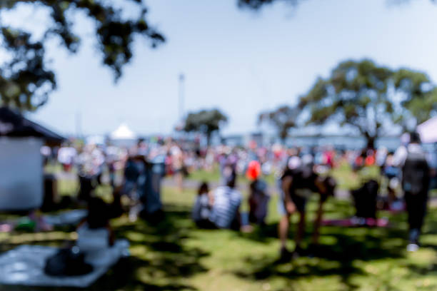 istock Blur defocused background of people in park 637092724
