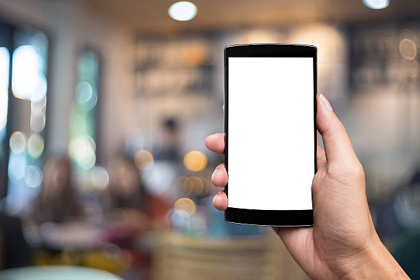 istock man holding smart phone with blank mobile can be add 637092892