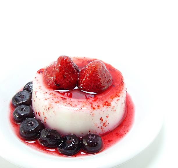 istock milk pudding dessert with strawberry and blue berry 637093978