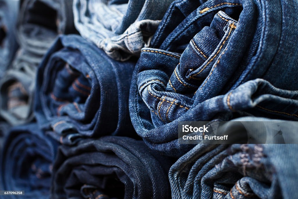 Different folded jeans Different folded jeans closeup Jeans Stock Photo