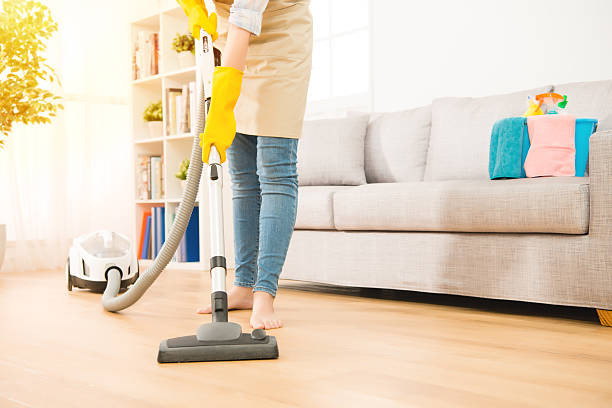 istock Woman use vacuum cleaner to cleaning 637099390