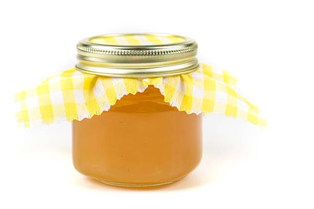 istock Jar of homemade pineapple jam isolated on a white background 637104708