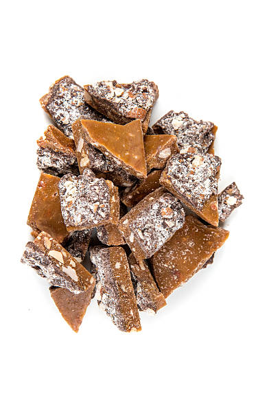 istock Homemade almond roca isolated on a white background 637104736