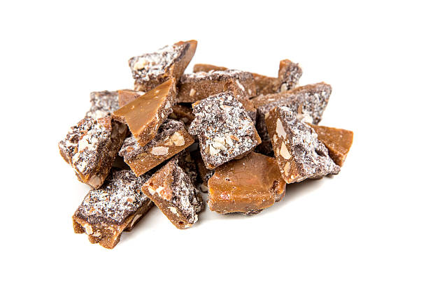 istock Homemade almond roca isolated on a white background 637104756