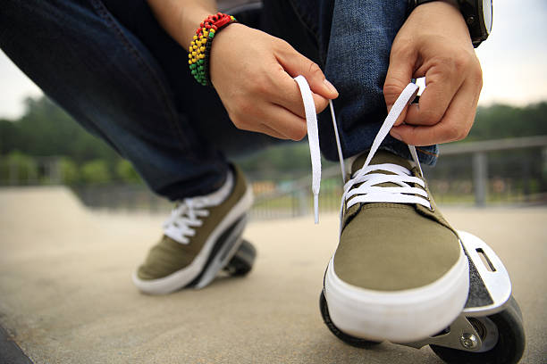 Close up man tying his shoes up