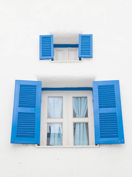 istock Santorini Greek style blue closed open windows 637105770