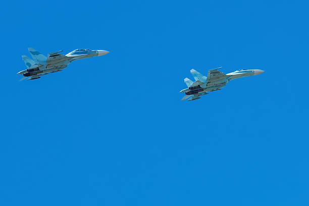 istock wide-body plane is flying in blue sky 637107666