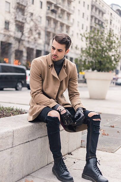 istock Beautiful young man posing in an urban context 637108274