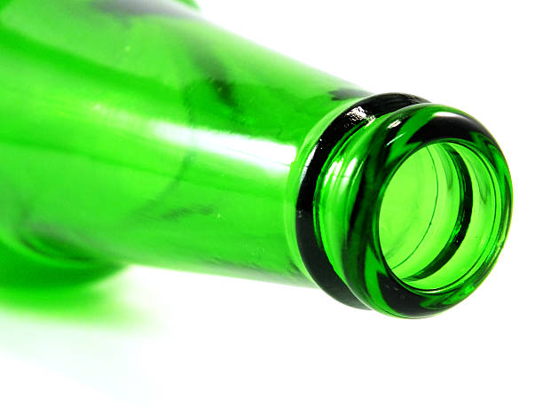 istock empty green glass bottle lying on isolated over white background 637111296