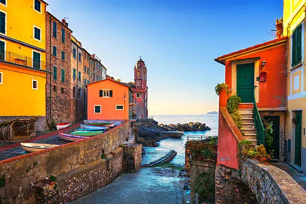 Tellaro sea village street, church and boats. Five lands, Cinque Terre, Liguria Italy Europe.