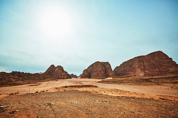 istock Amazing sunny panorama with red rocks in Wadi Rum desert 637115188