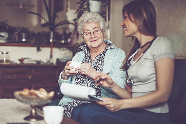 istock Social worker is visiting a senior woman 637115794