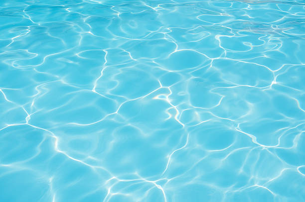 istock Blue water surface in swimming pool for background 637115860