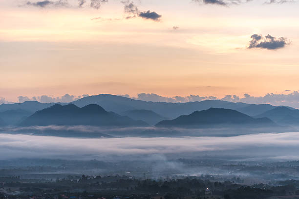 istock mountain  with fog in morning 637116080