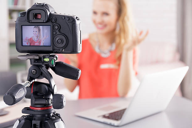 istock Woman filming her broadcast 637118458