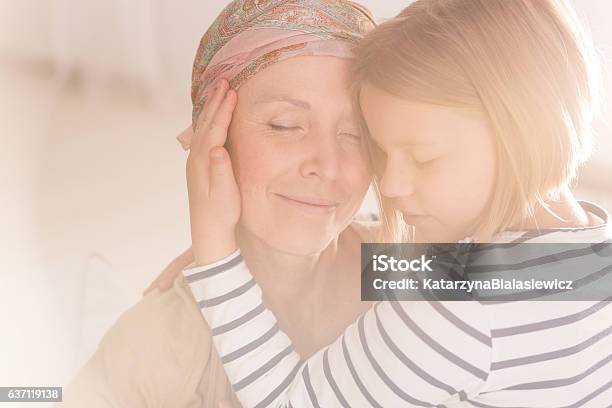 Small Caring Child Embracing Mother Stock Photo - Download Image Now - Cancer - Illness, Family, Hope - Concept