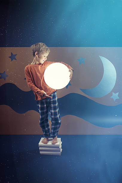 istock Boy keeping the shining ball 637119678