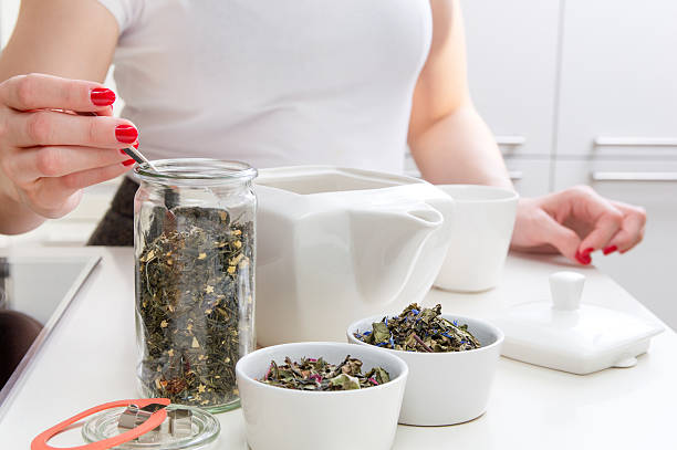 istock Young woman prepares brew green tea 637121688