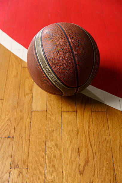 istock Basketball ball on court floor 637122318