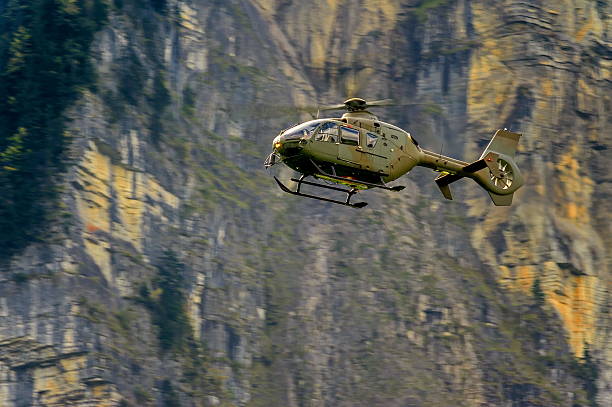 istock Military helicopter in the sky 637123036