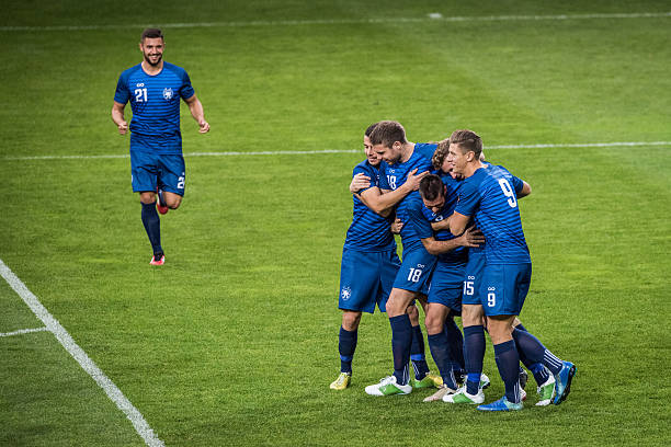 istock Football players celebrating 637128312